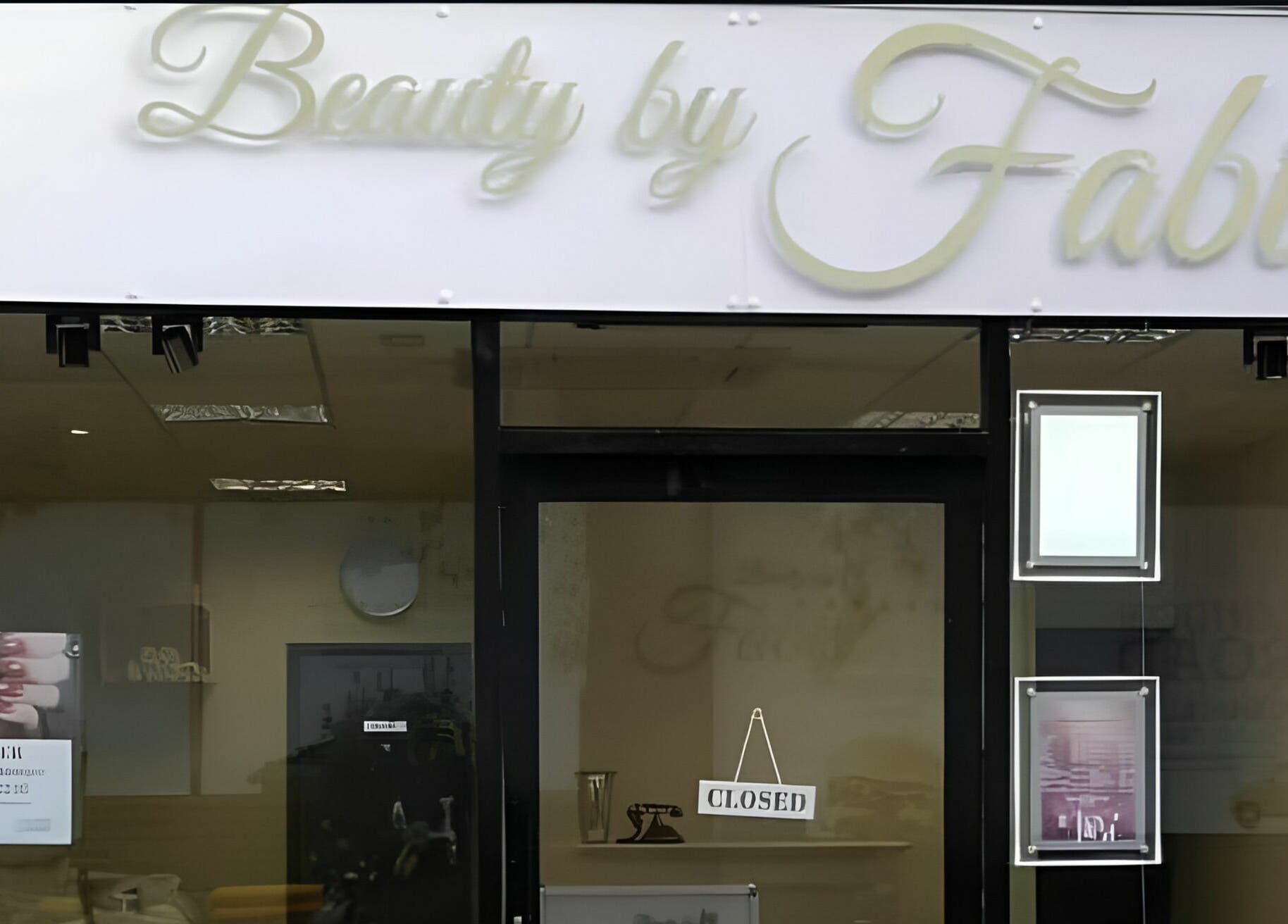 Front view of Beauty by Fabi salon in Camberley, England, GB with a closed sign on the door.
