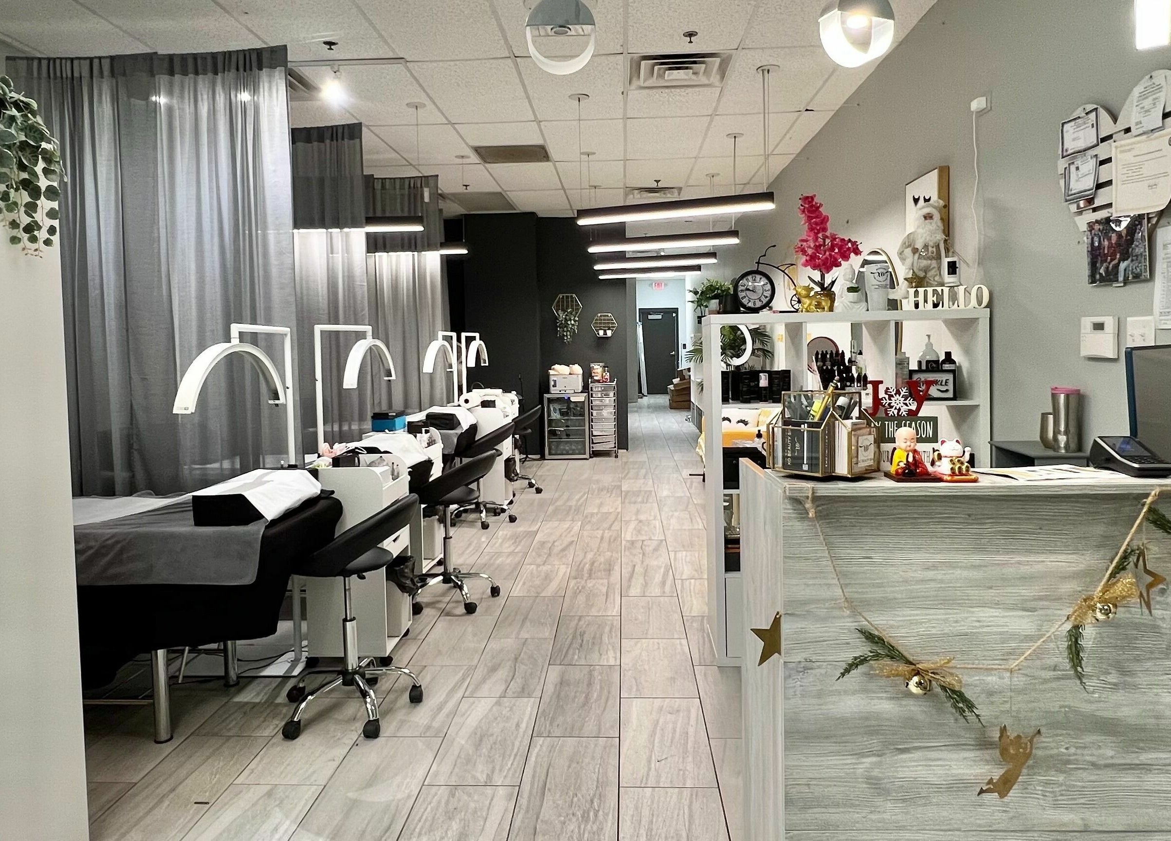 Modern interior of XO Beauty Spa in Chatham, Illinois, US, featuring treatment stations and chic decor.