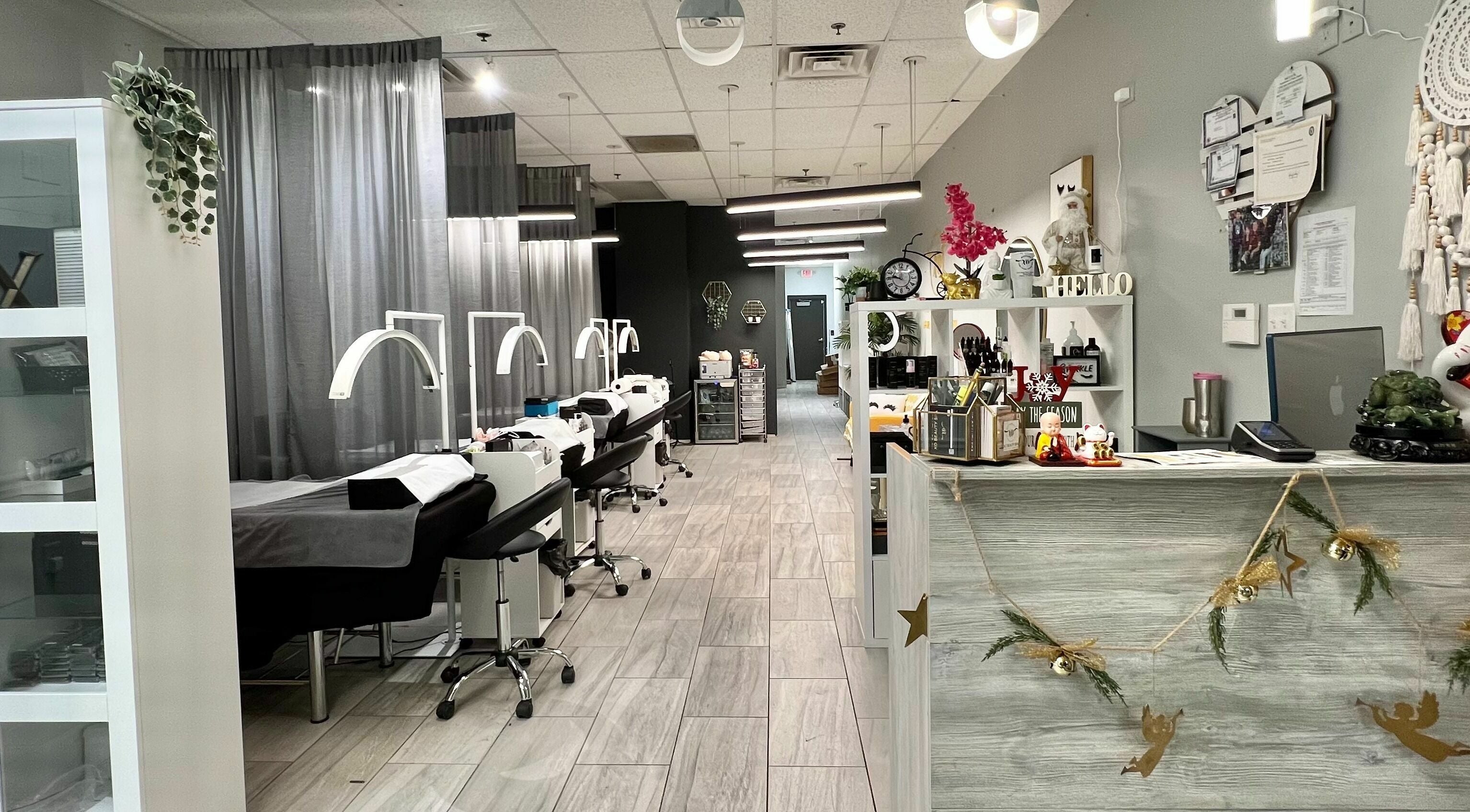 Modern interior of XO Beauty Spa in Chatham, Illinois, US, featuring treatment stations and chic decor.