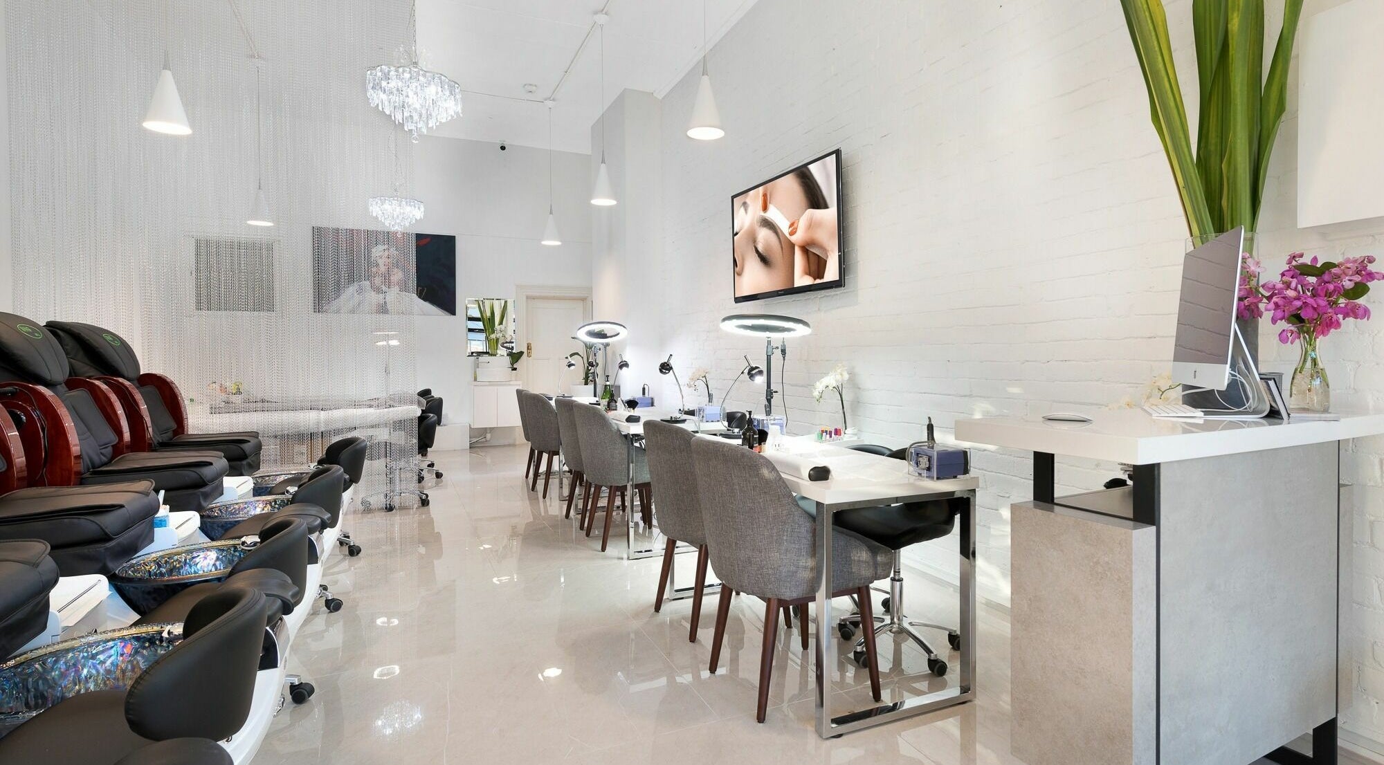 Elegant interior of Blinq Beauty, Richmond, Victoria, AU, featuring modern nail and pedicure stations.