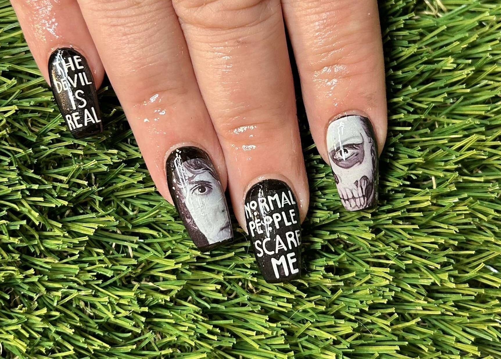 Bold, artistic nail design at Vanilla Salon in Leeds, England. Detailed black and white nail art.