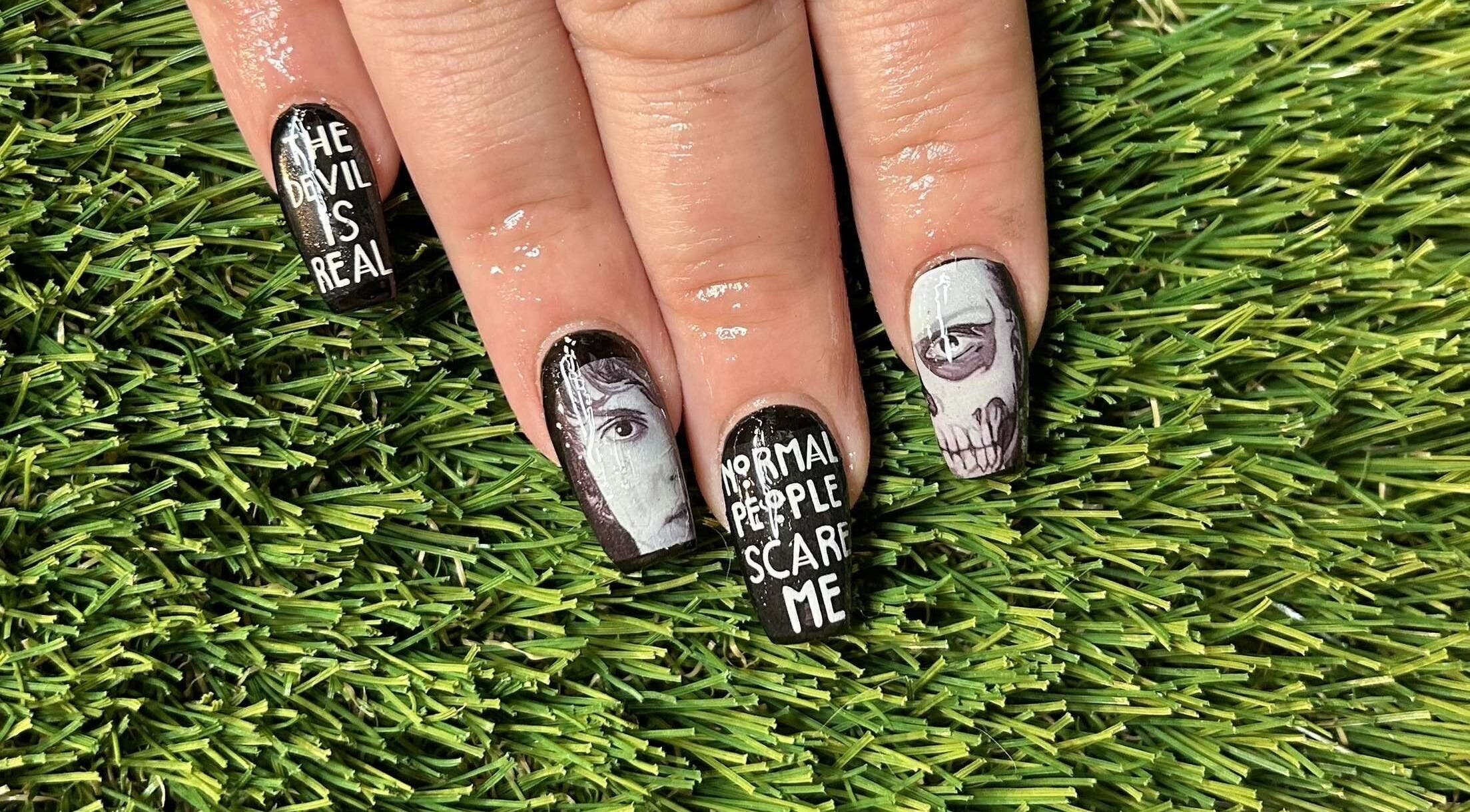 Bold, artistic nail design at Vanilla Salon in Leeds, England. Detailed black and white nail art.