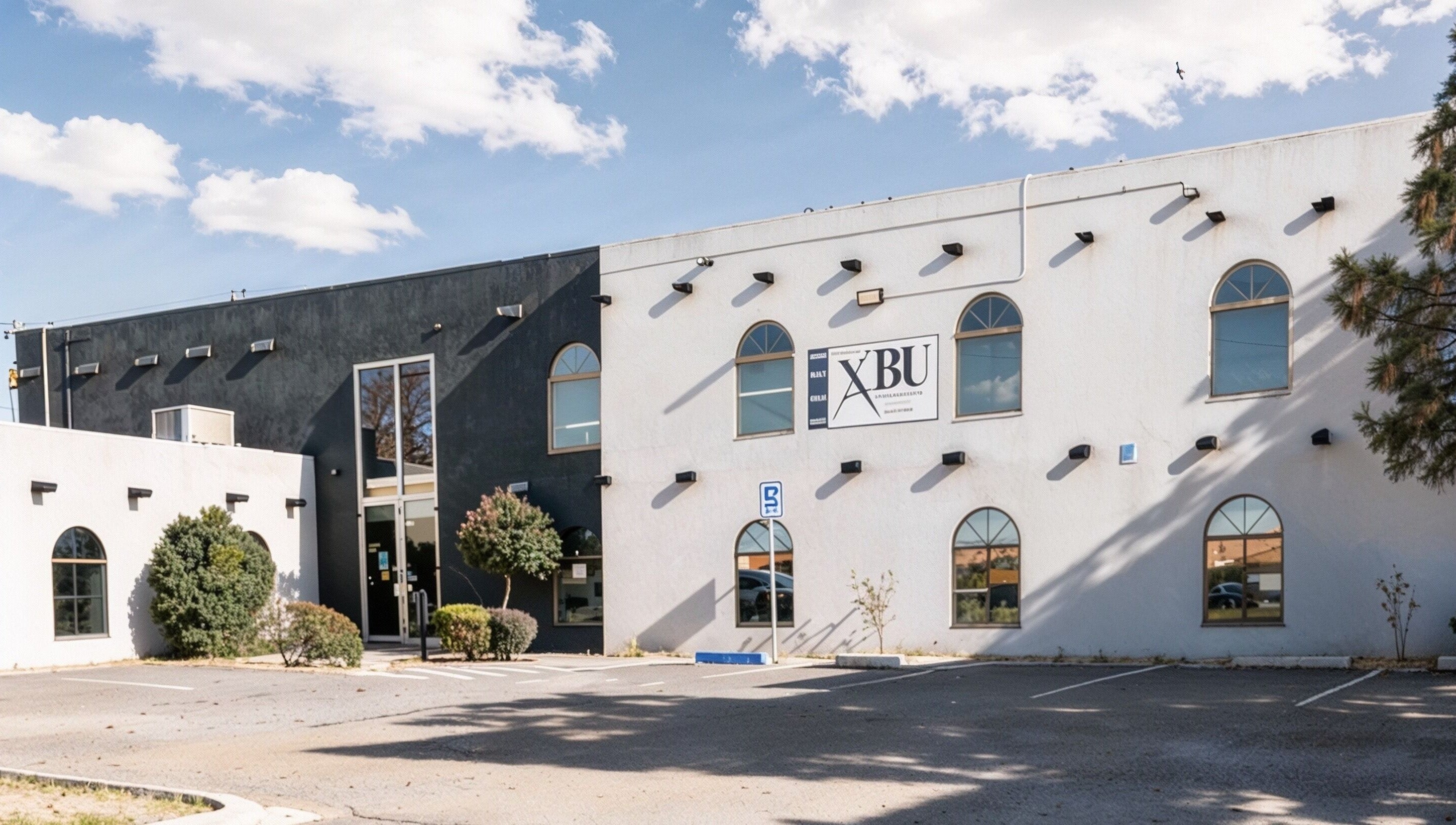 Exterior view of A Better U Beauty Barber Academy in Albuquerque, New Mexico, US under a clear sky.