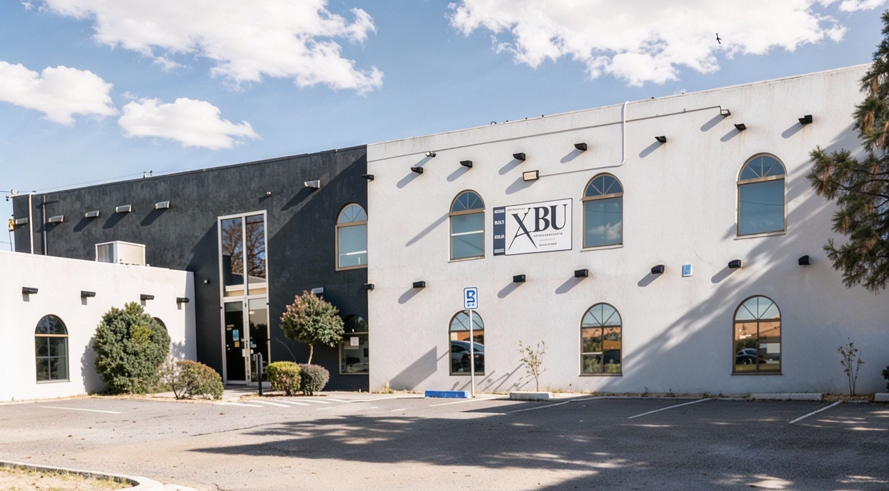 Exterior view of A Better U Beauty Barber Academy in Albuquerque, New Mexico, US under a clear sky.