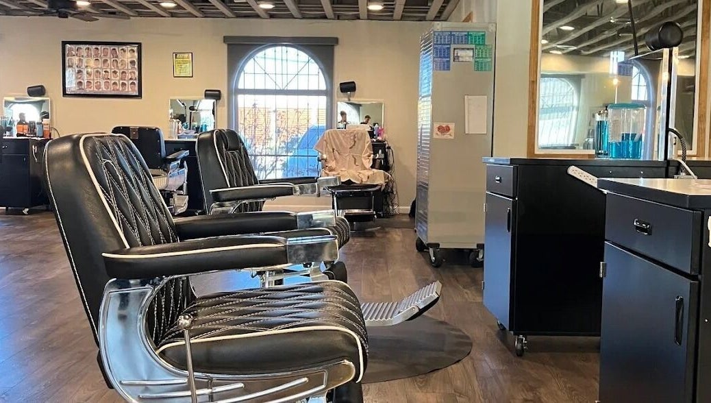 Stylish barber chairs at A Better U Beauty Barber Academy in Albuquerque, New Mexico, US, enhancing the modern salon vibe.
