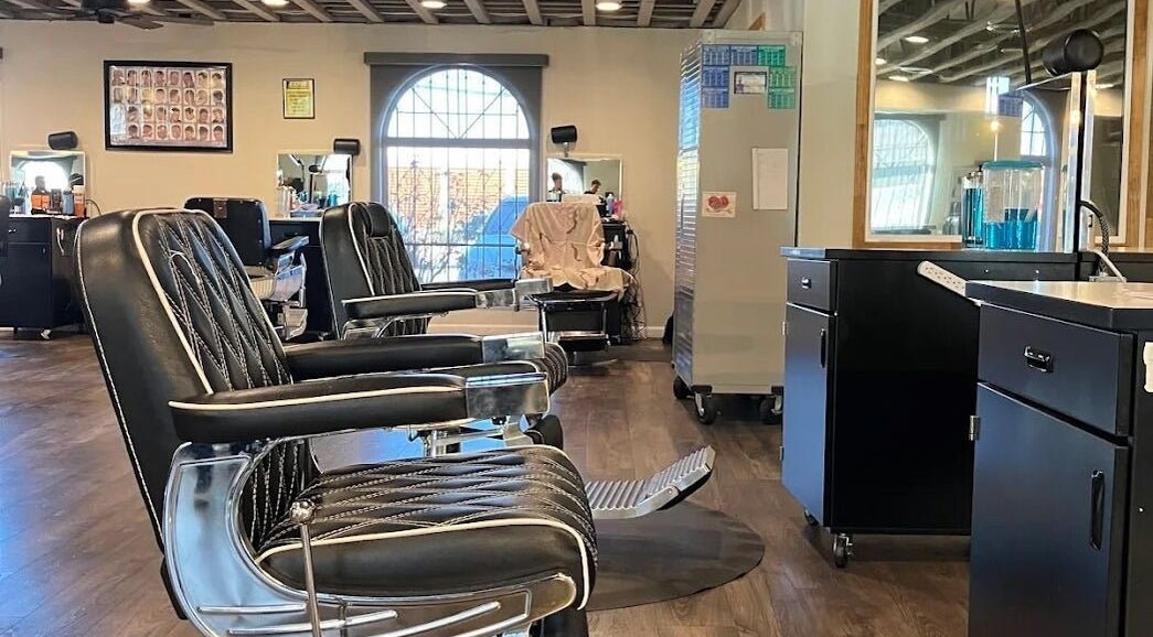 Stylish barber chairs at A Better U Beauty Barber Academy in Albuquerque, New Mexico, US, enhancing the modern salon vibe.