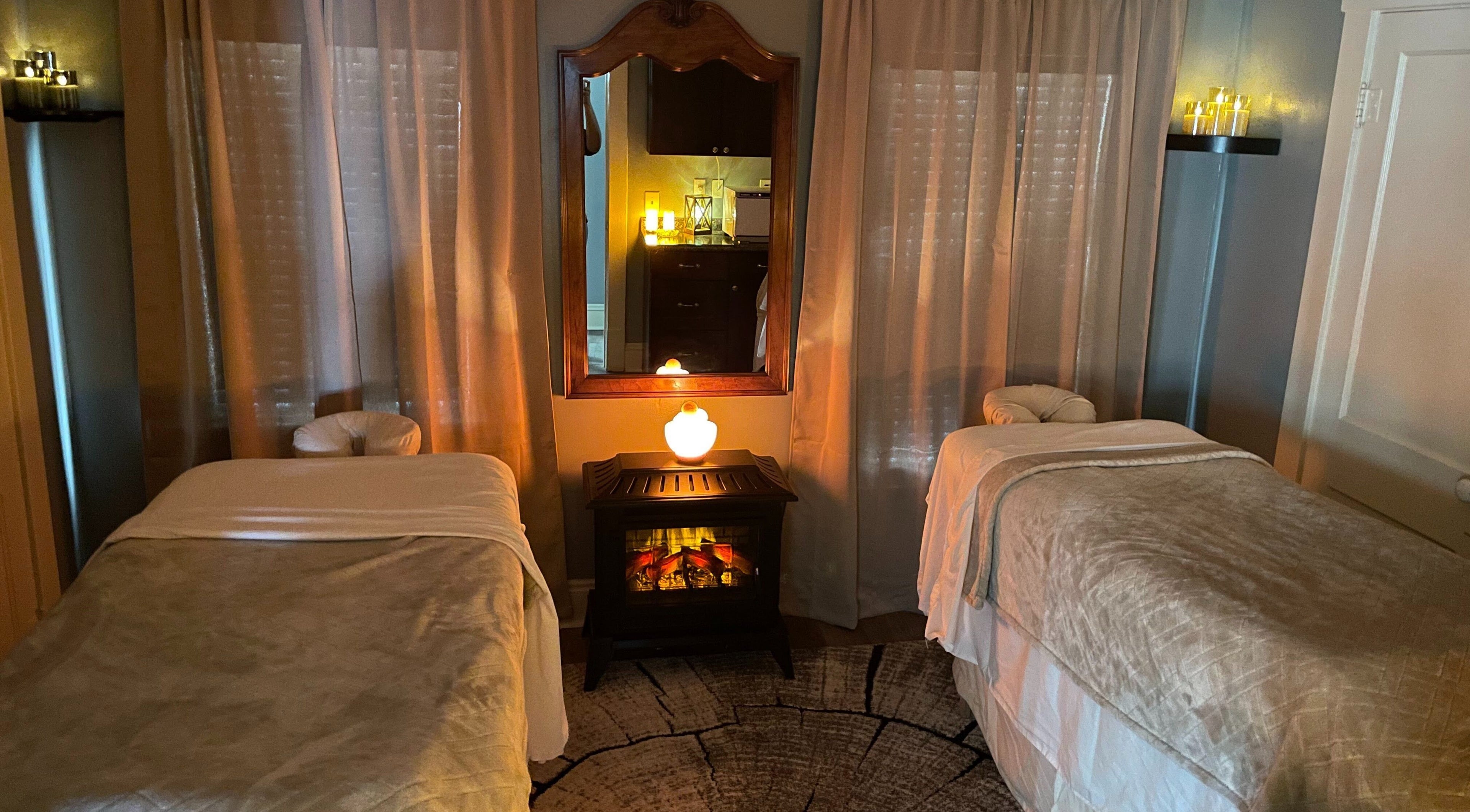 Relaxing massage room at Firewood Spa in Brecksville, Ohio, US with warm lighting and soft linens.