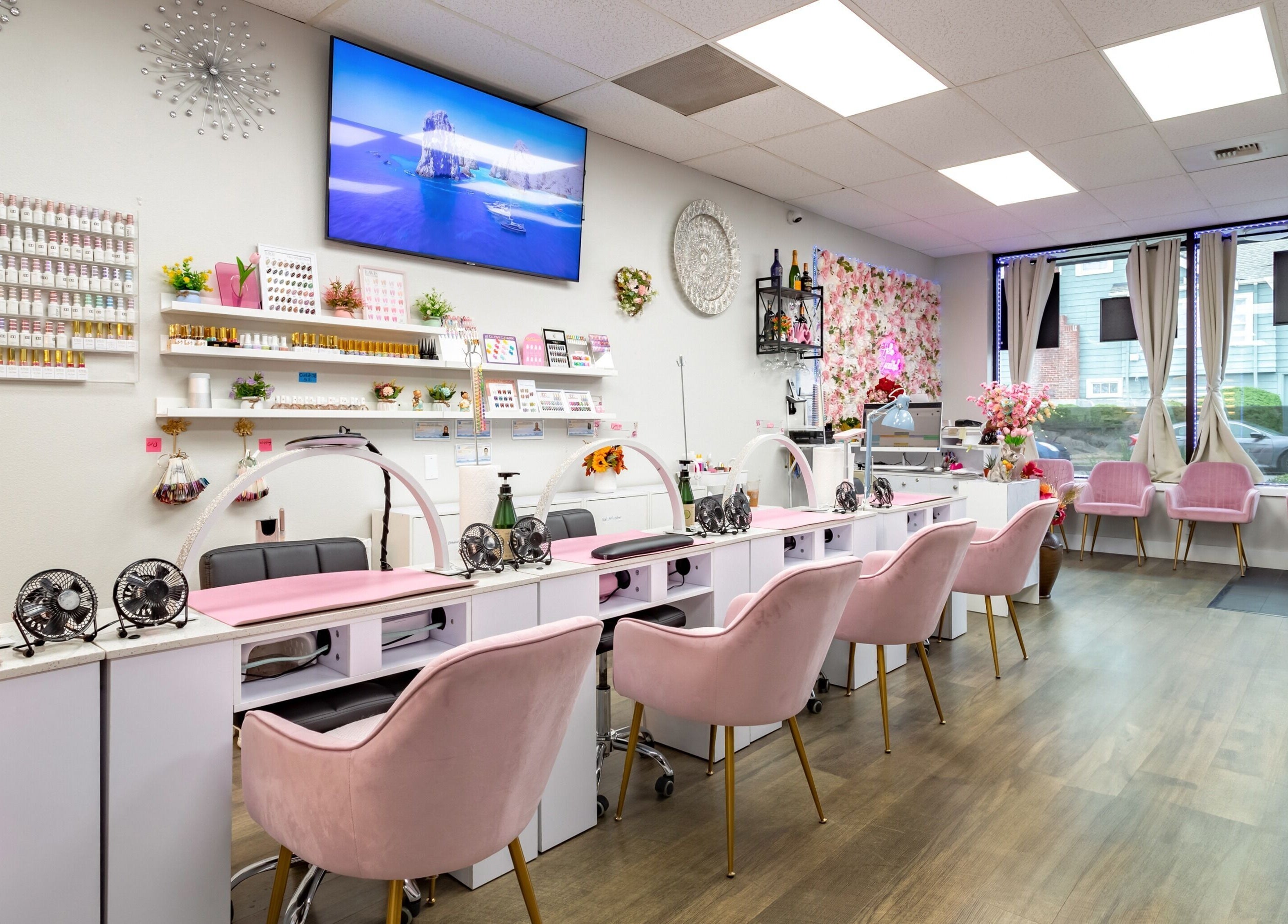 Jenny Nails Salon in Seattle, Washington, with chic pink chairs and elegant decor creating a serene ambiance.