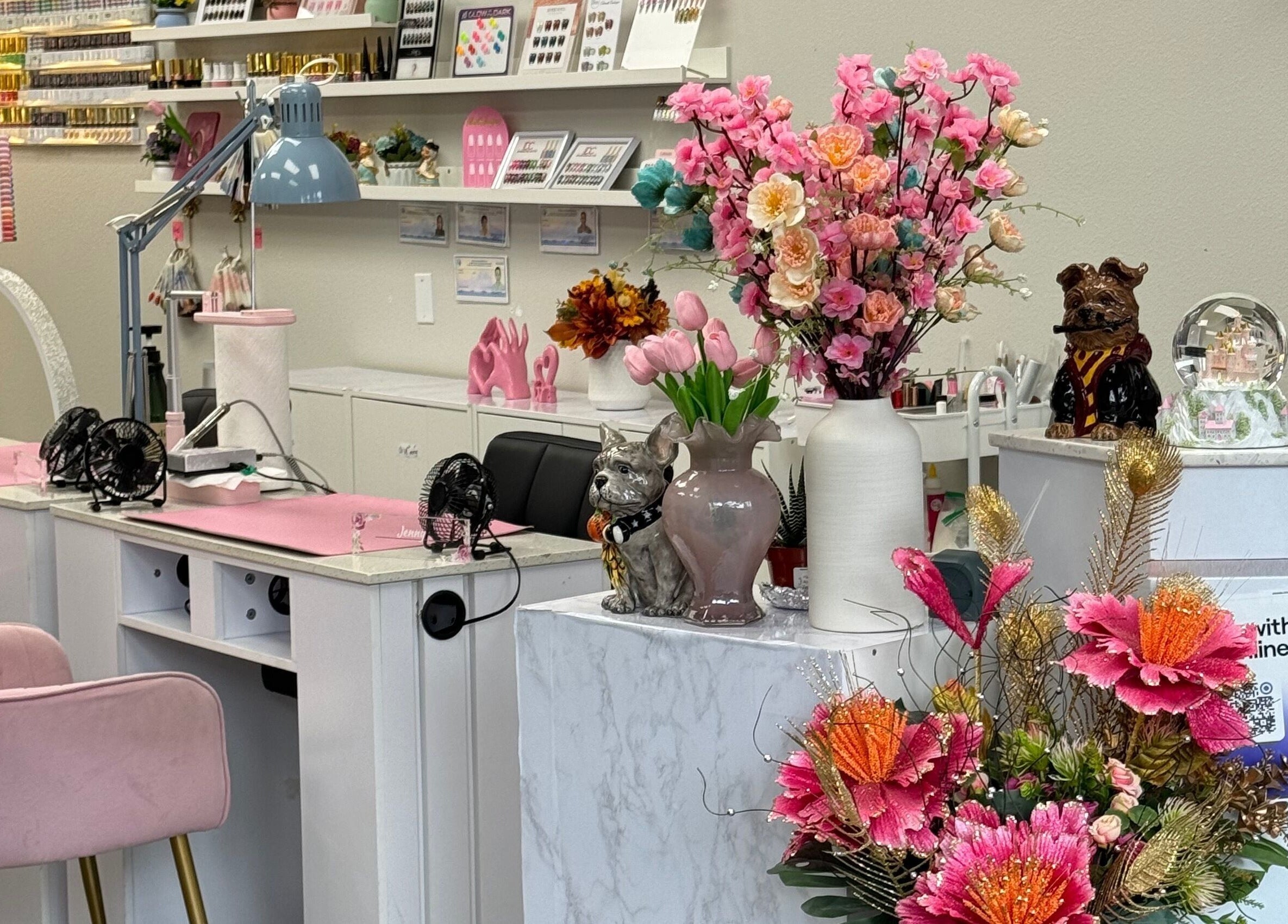 Elegant nail station with pink chairs and floral decor at Jenny Nails Salon in Seattle, Washington, US.
