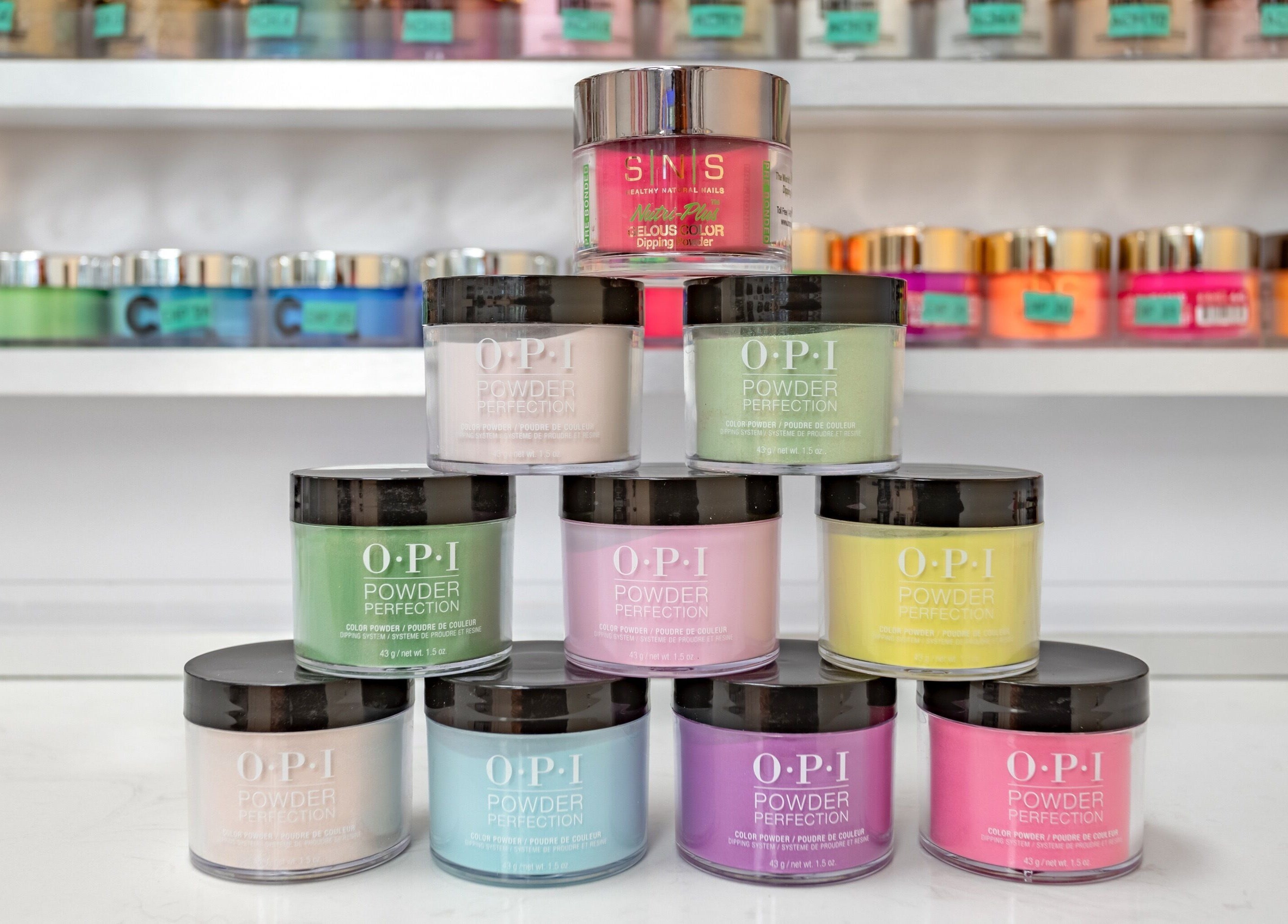 Colorful nail powders displayed at Jenny Nails Salon, Seattle, Washington, US for vibrant manicures.