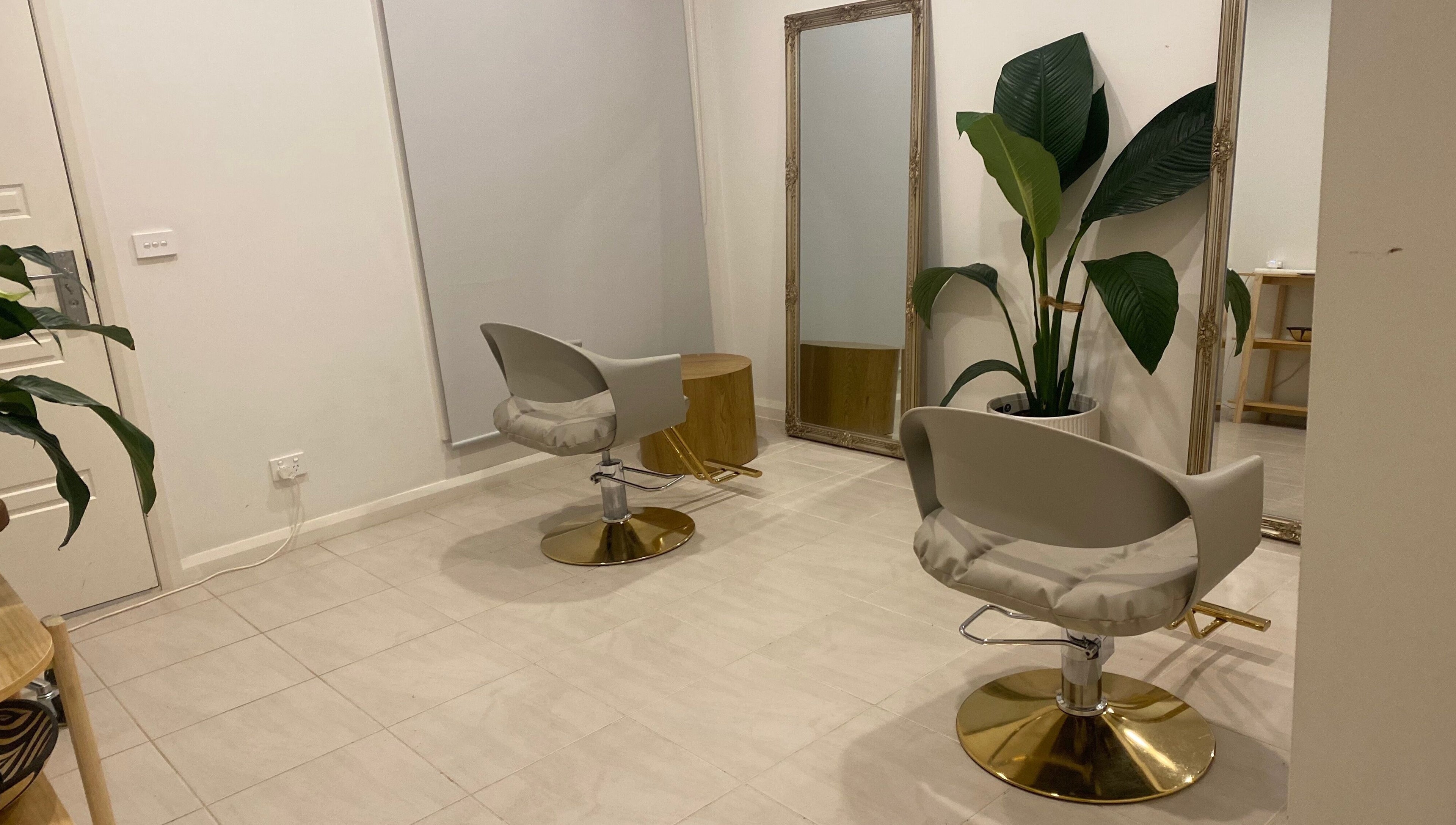 Elegant salon chairs and mirrors at MISSD and Co Salon, Melbourne, Victoria, AU, offering a serene beauty experience.