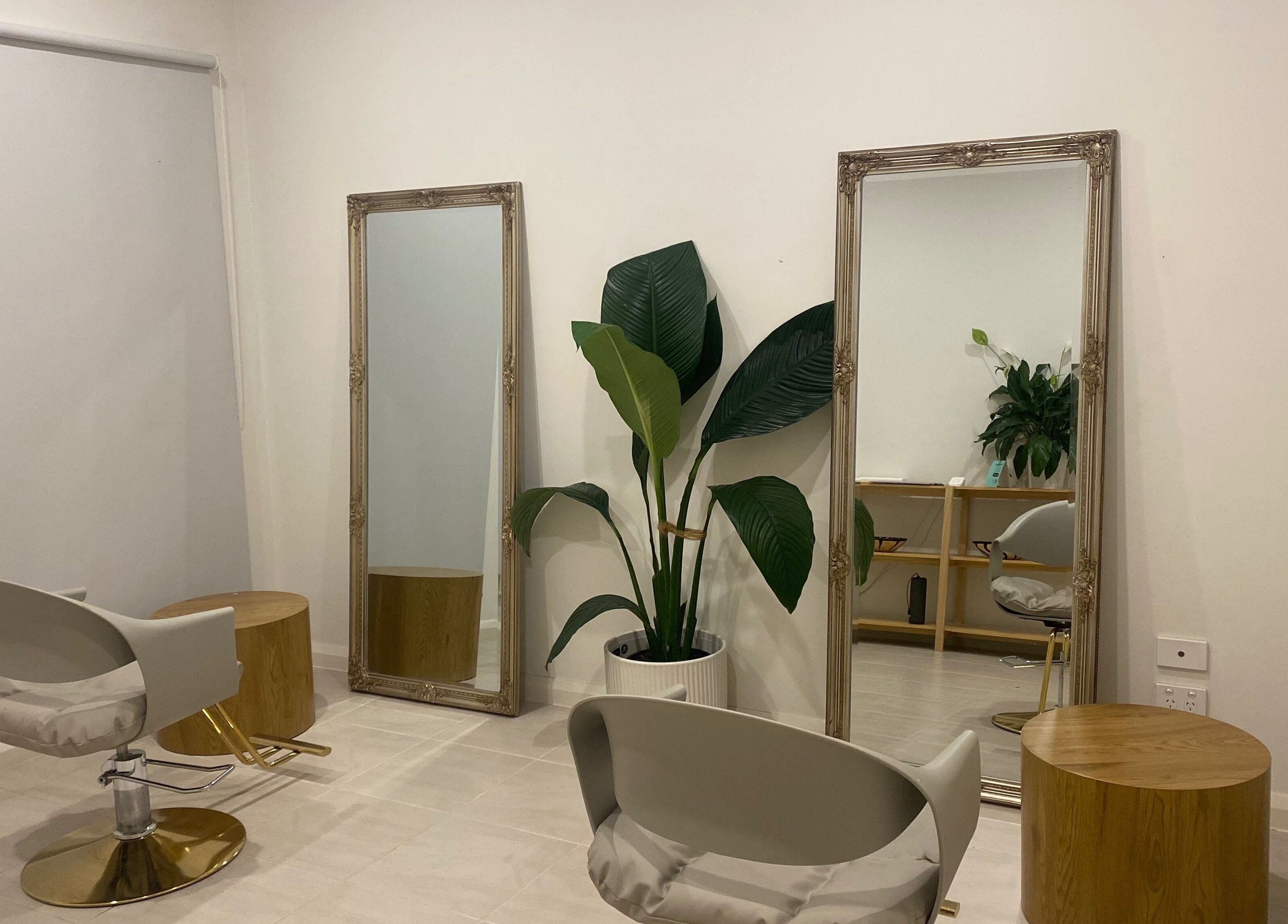 Stylish interior of MISSD and Co Salon, Melbourne, Victoria, AU with modern chairs and elegant mirrors.