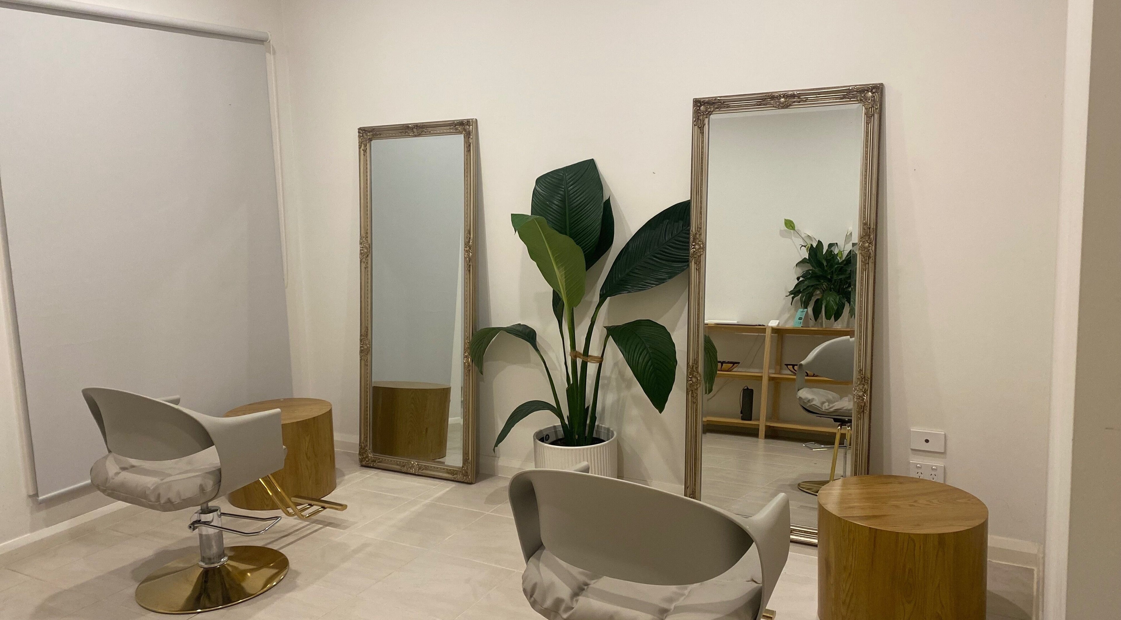 Stylish interior of MISSD and Co Salon, Melbourne, Victoria, AU with modern chairs and elegant mirrors.