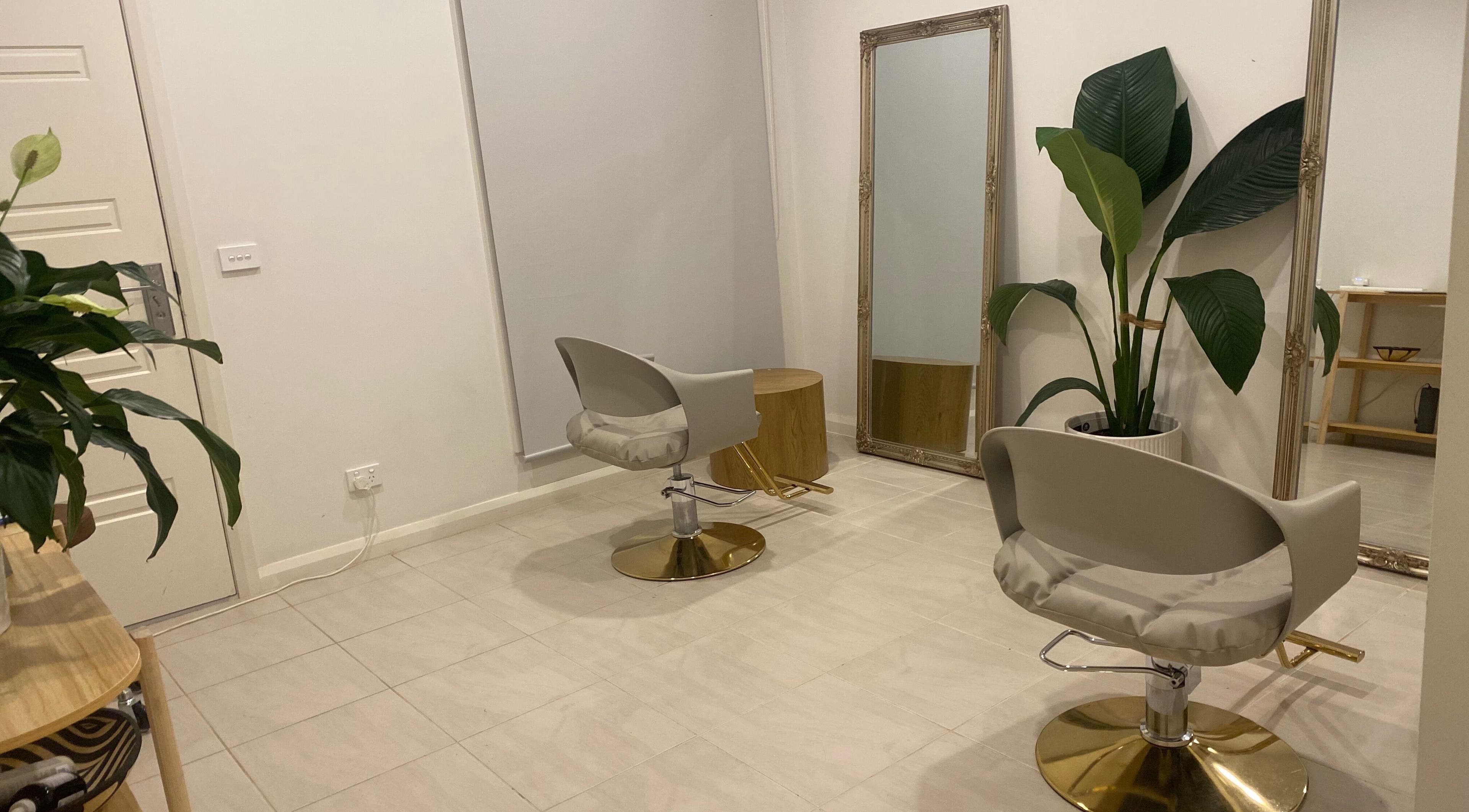 Elegant interior of MISSD and Co Salon in Melbourne, Victoria, AU featuring modern chairs and lush greenery.