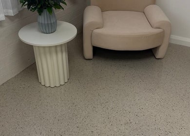Relaxing lounge area at LUX Head and Body Spa, Riverstone, New South Wales, AU featuring an elegant chair and table.