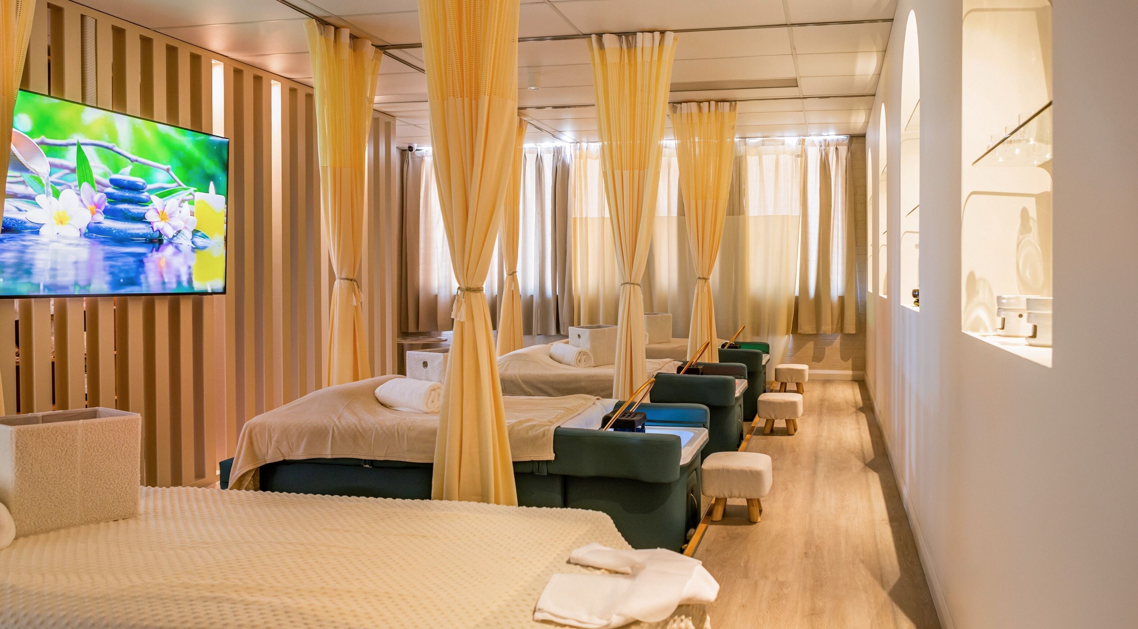 Tranquil massage room at LUX Head and Body Spa in Riverstone, New South Wales, AU, with comfortable beds and soothing decor.