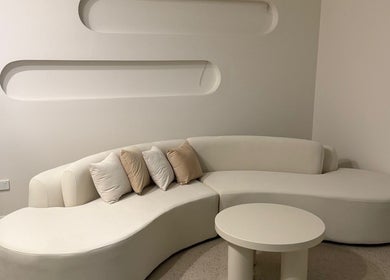 Elegant cream lounge area at LUX Head and Body Spa in Riverstone, New South Wales, AU, inviting relaxation.