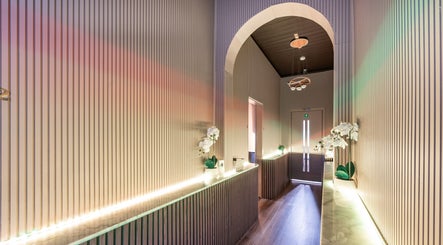 Elegant hallway at Riverstone Thai Massage Therapy and Spa, Riverstone, NSW, AU with soft lighting and orchids.