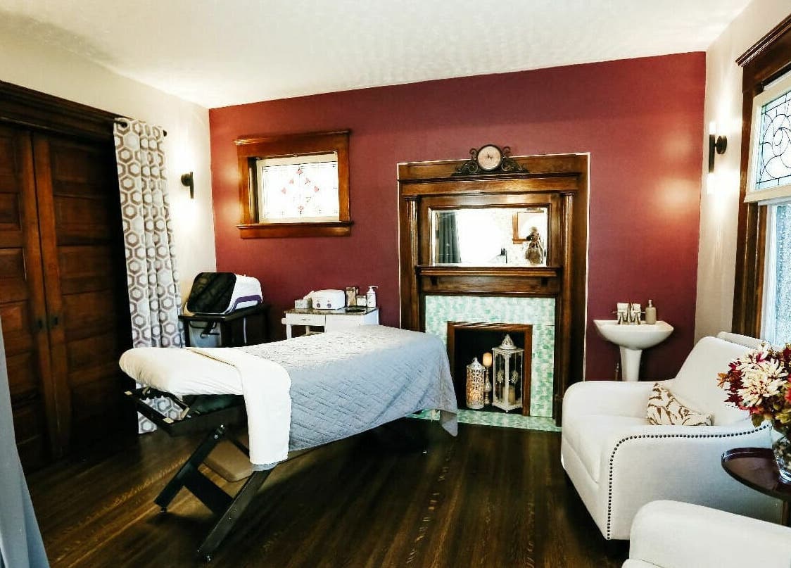 Cozy massage room at Relish Day Spa, Stratford, Ontario, CA, featuring elegant decor and a comfortable treatment bed.
