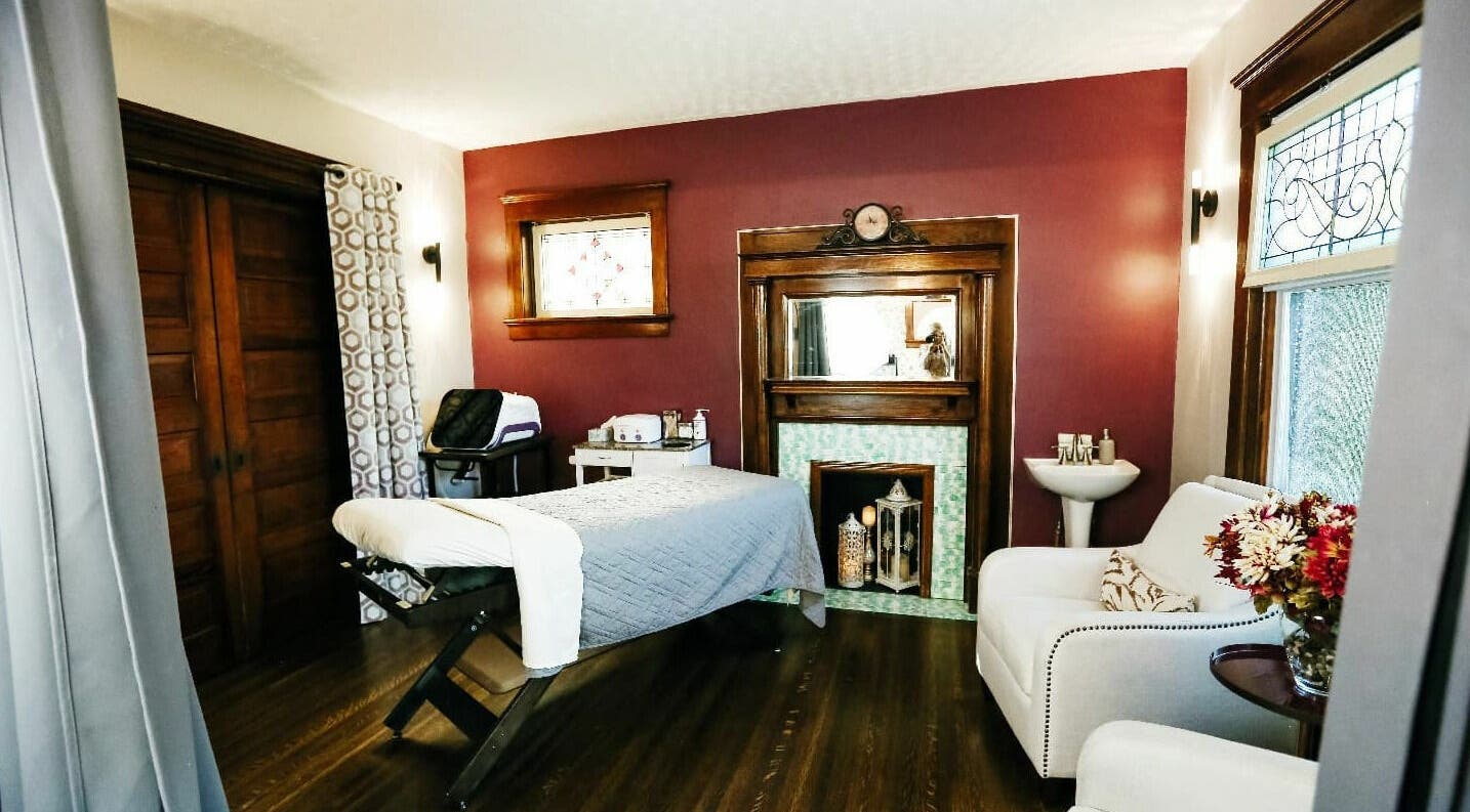 Cozy massage room at Relish Day Spa, Stratford, Ontario, CA, featuring elegant decor and a comfortable treatment bed.
