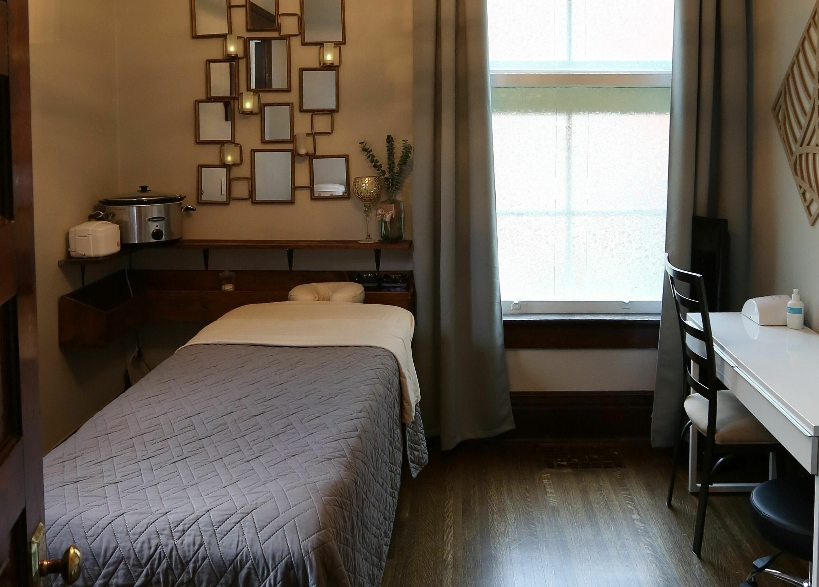 Tranquil massage room at Relish Day Spa, Stratford, Ontario, CA, with elegant decor and soothing ambiance.