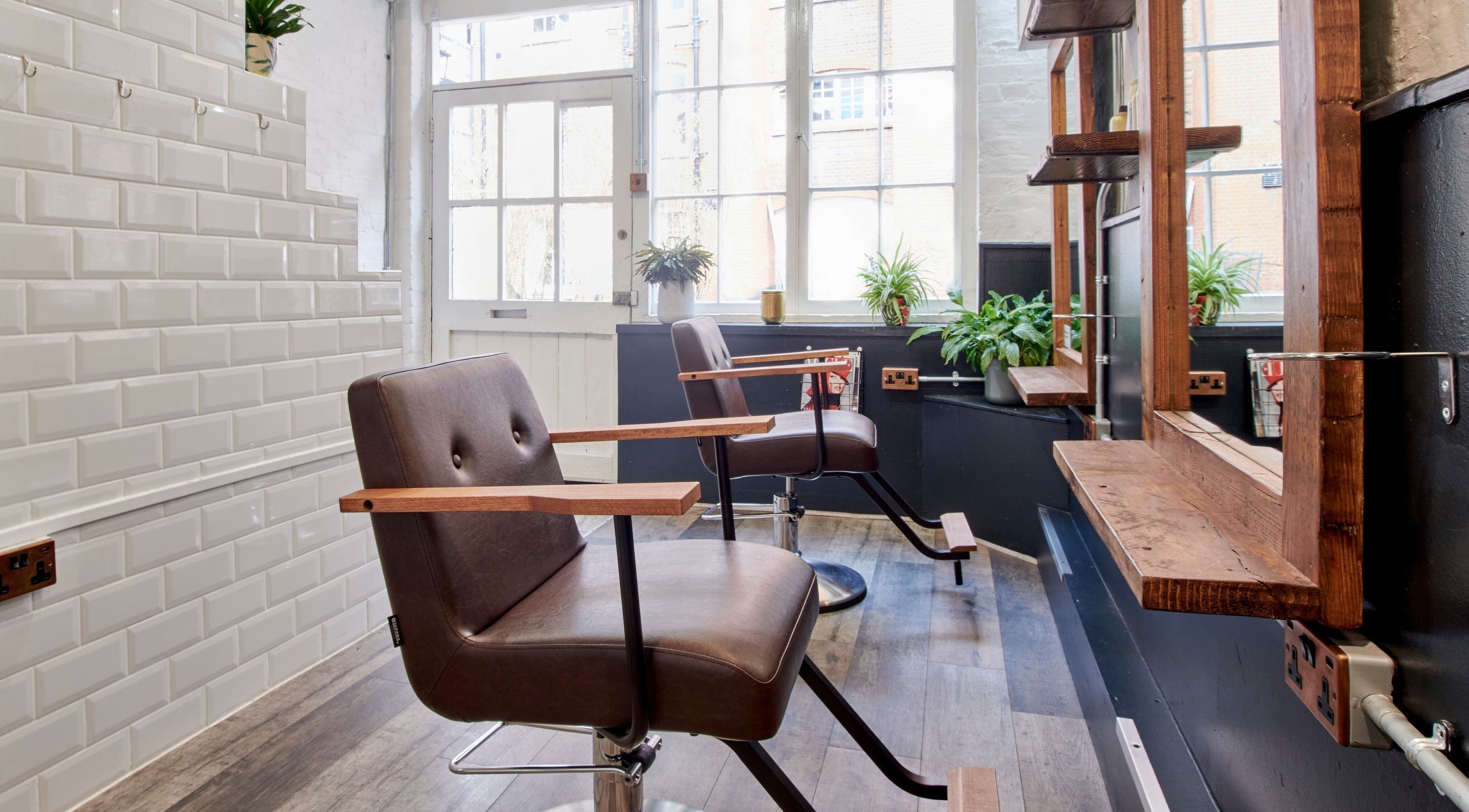 Elegant salon interior with vintage chairs at Notice Hair Salon, London, England, GB.
