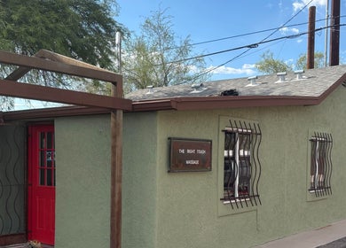 The Right Touch Massage LLC entrance in Tucson, Arizona, US with a welcoming red door.