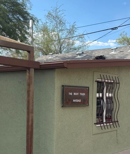 The Right Touch Massage LLC entrance in Tucson, Arizona, US with a welcoming red door.