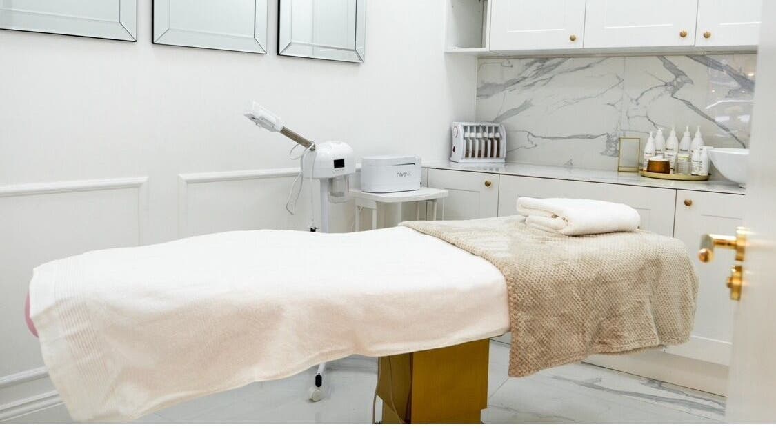 Luxurious treatment room at The Dolls London NW4, London, England, GB, featuring plush bed and modern decor.