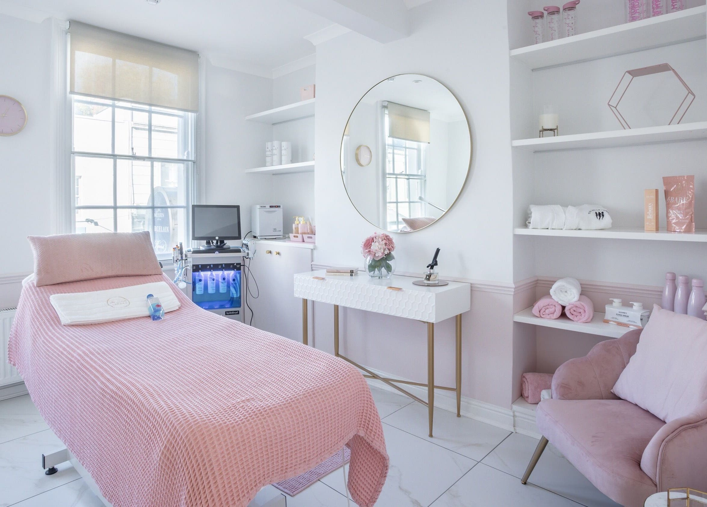 Luxurious treatment room at The Dolls London SW3, London, England, GB with pink accents and modern decor.