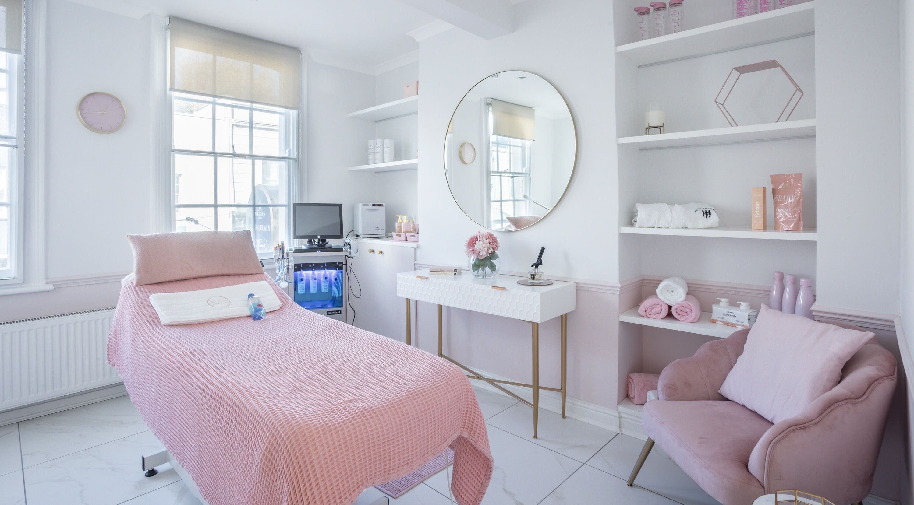 Luxurious treatment room at The Dolls London SW3, London, England, GB with pink accents and modern decor.