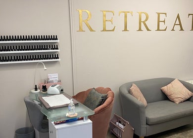 Elegant nail salon setup at The Beauty Room Danebury Practice, Andover, England, GB, featuring cozy seating.
