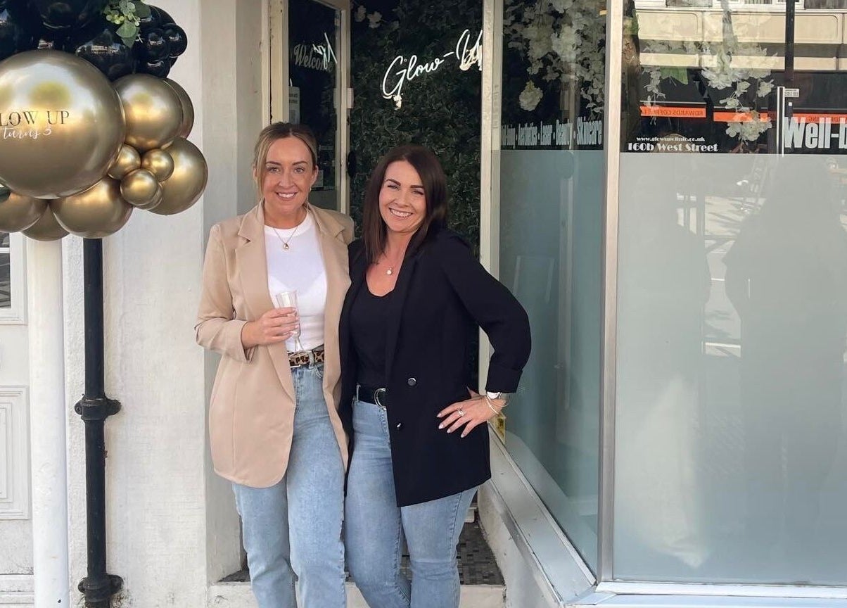 Guests at The Glow Up Clinic, Fareham enjoying a welcoming moment with elegant decor.