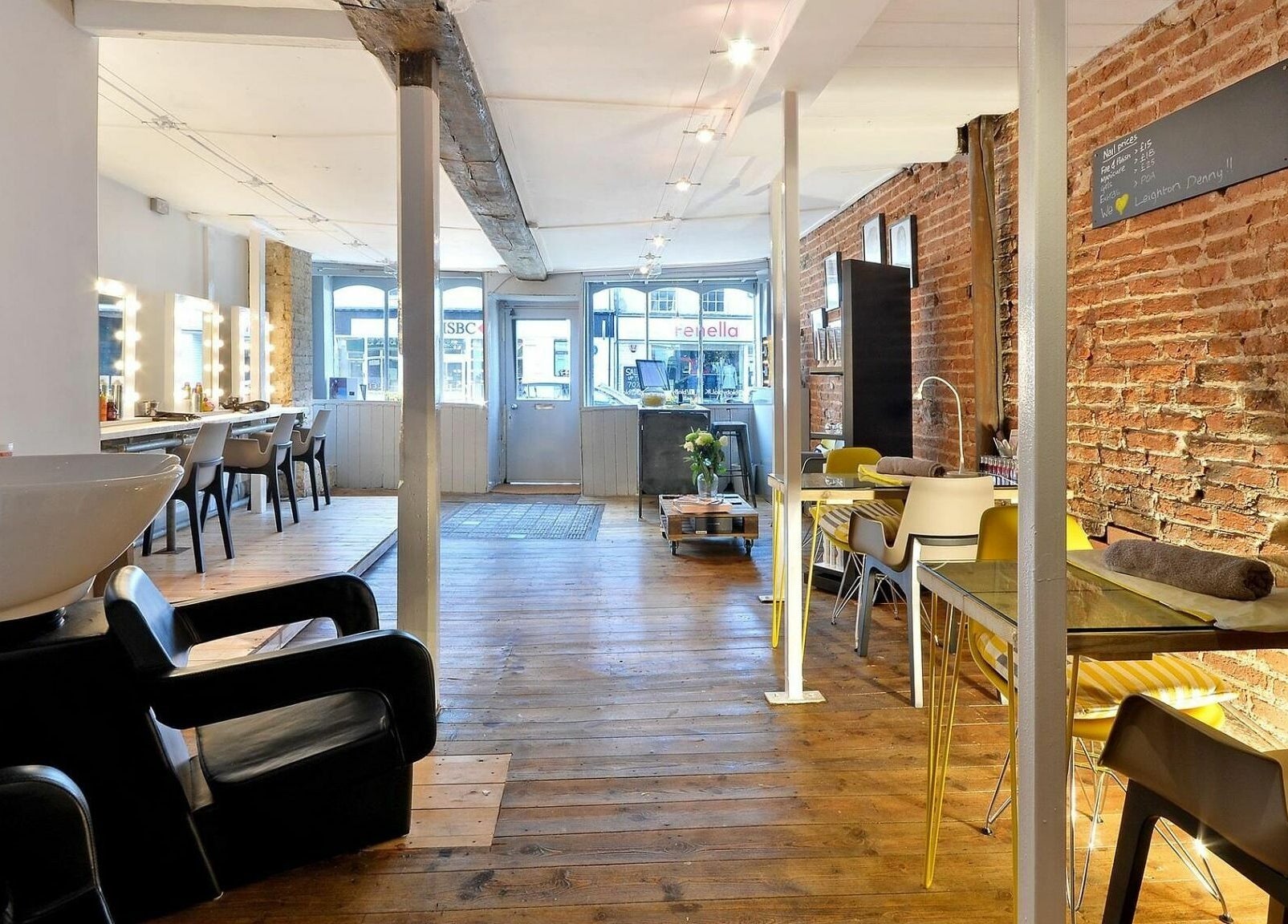 Chic interior of Blo by Blo in Ware, England, GB, featuring wooden floors and stylish salon stations.