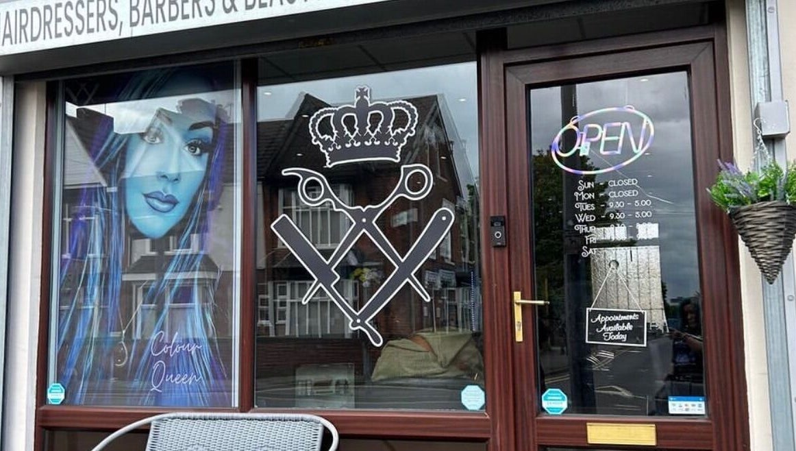 Entrance of Colour Queen salon in Scunthorpe, England, with stylish window graphics and open sign.