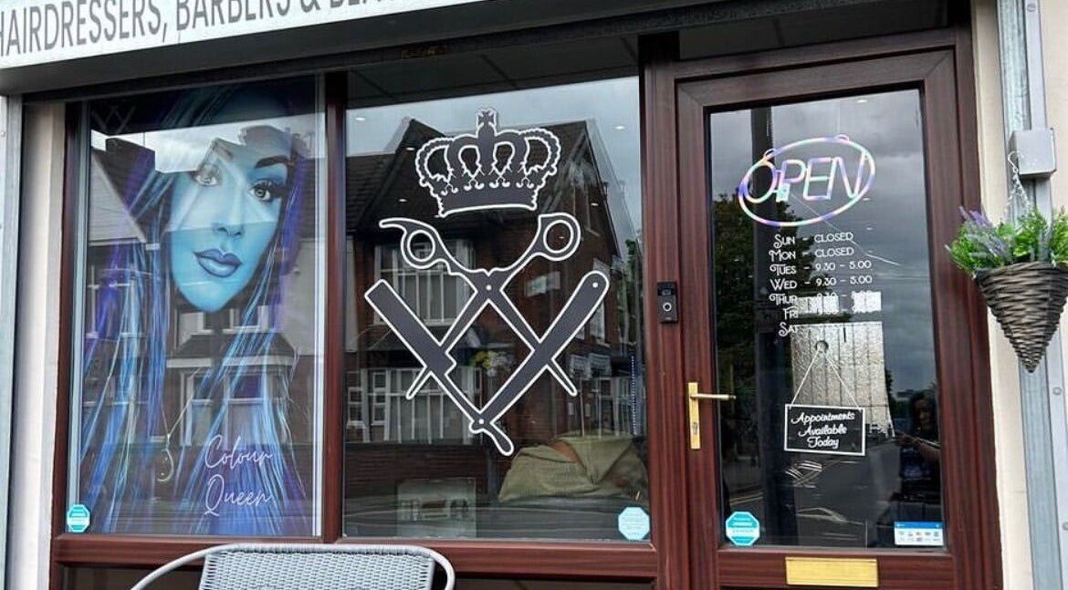 Entrance of Colour Queen salon in Scunthorpe, England, with stylish window graphics and open sign.