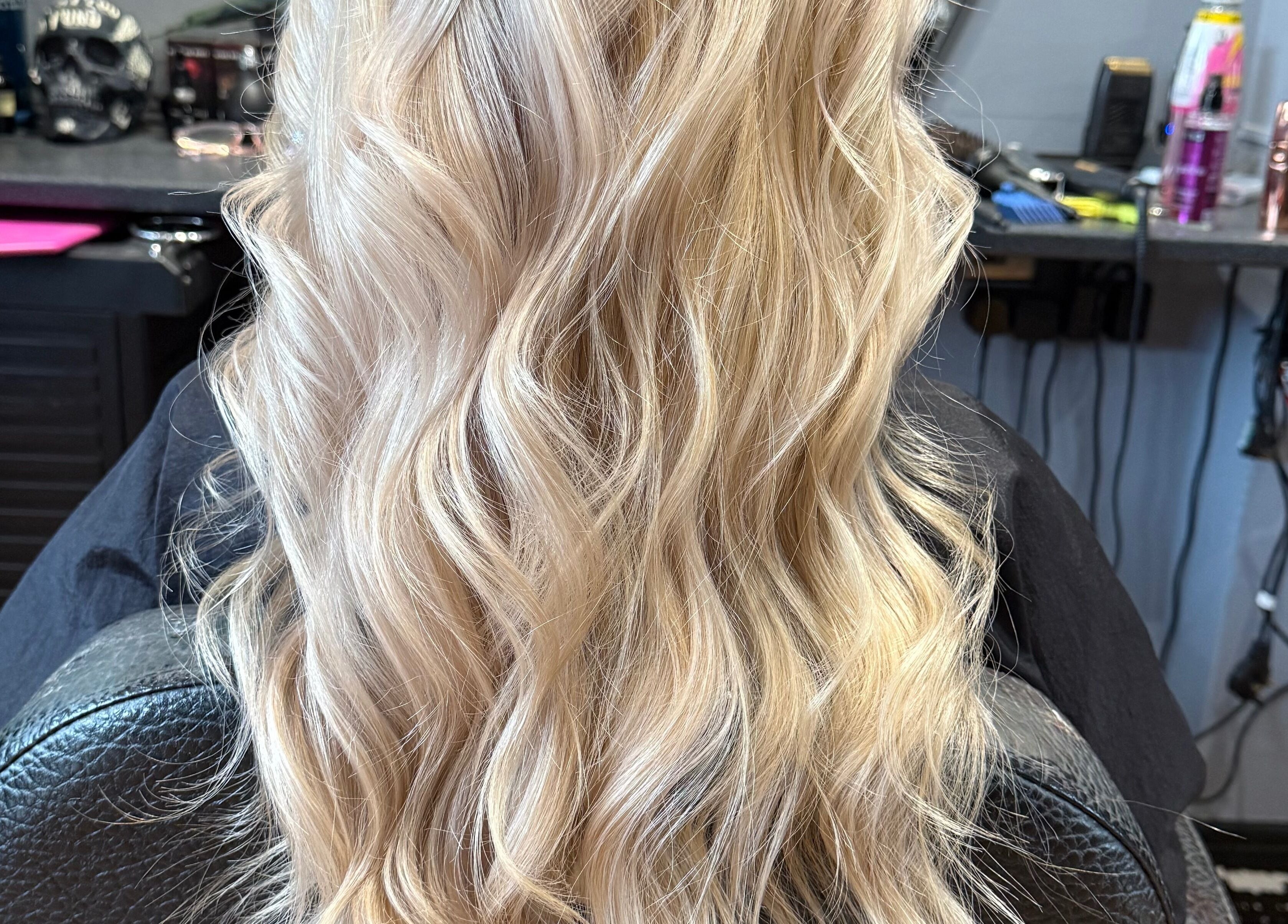Flowing blonde waves styled at Colour Queen in Scunthorpe, England, GB hair salon.