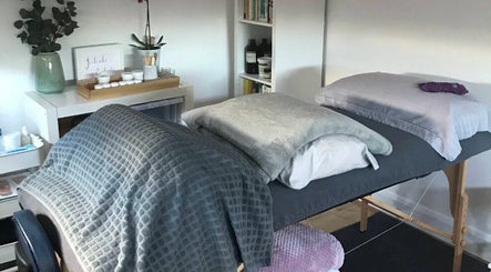 Tranquil massage setup at The Relaxation Room Leixlip, County Kildare, IE, featuring plush bedding and calming decor.