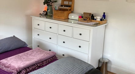 The Relaxation Room Leixlip in County Kildare featuring a calming white dresser with essential oils.
