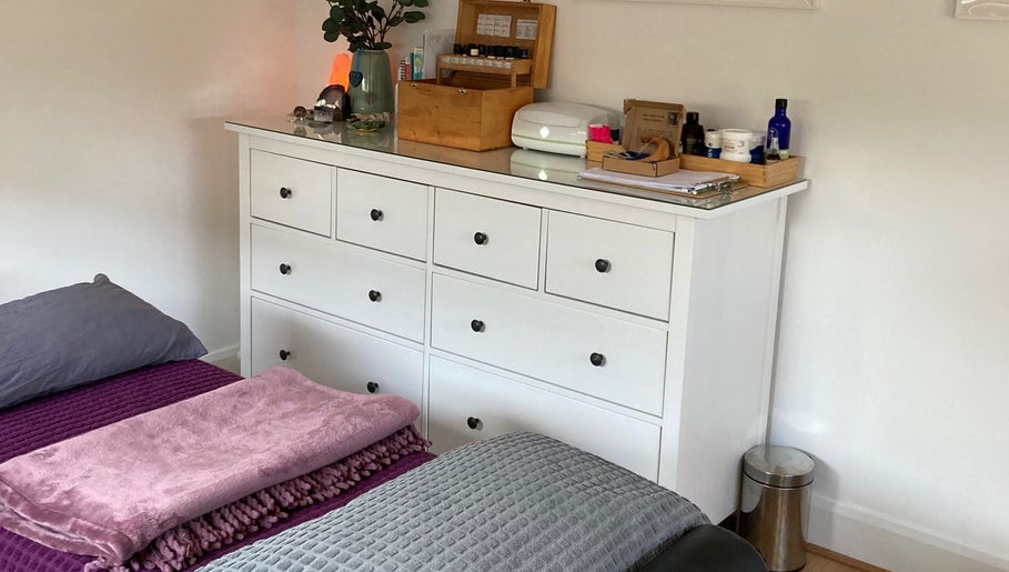 A serene corner at The Relaxation Room Leixlip, featuring a dresser and massage bed in Leixlip, County Kildare, IE.