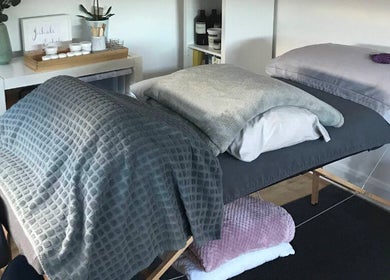 Inviting massage table at The Relaxation Room Leixlip, County Kildare, IE, with cozy blankets and serene decor.