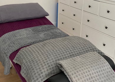 Comfortable treatment bed at The Relaxation Room Leixlip, Leixlip, County Kildare, IE for ultimate relaxation.