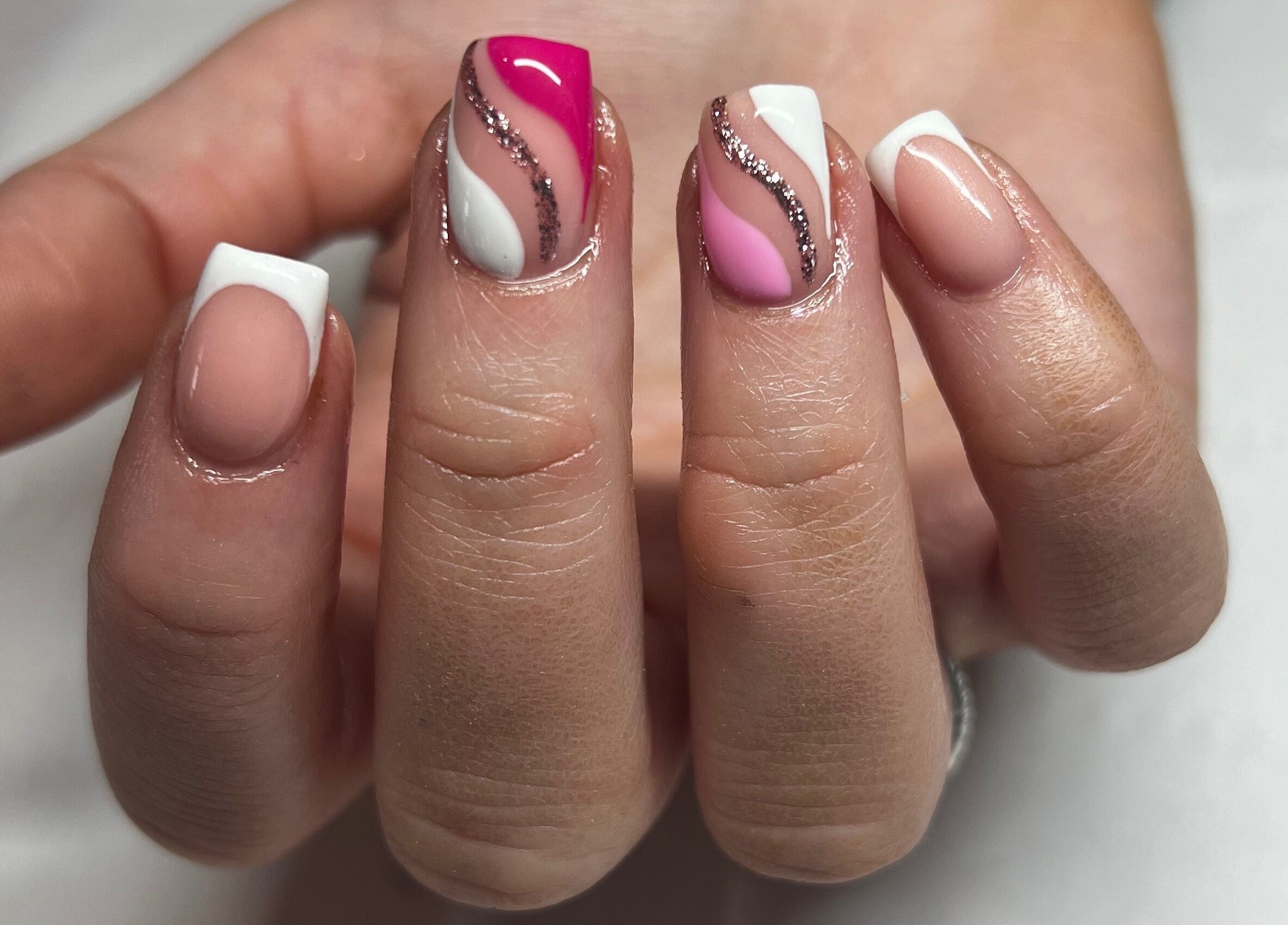 Stylish nail art at Becca Kate Nails, Castlederg, Northern Ireland, GB featuring pink and white designs.