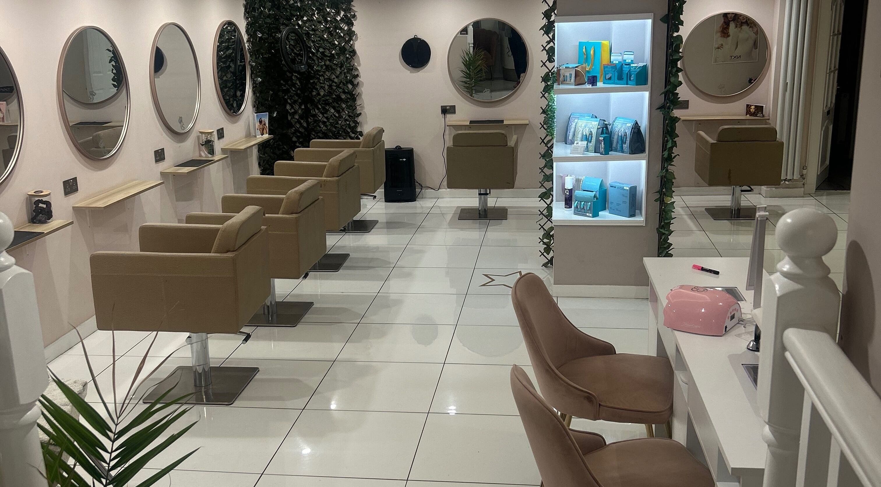 Elegant interior of Cody Shaw Hair & Beauty in Musselburgh, Scotland, GB with modern styling stations.