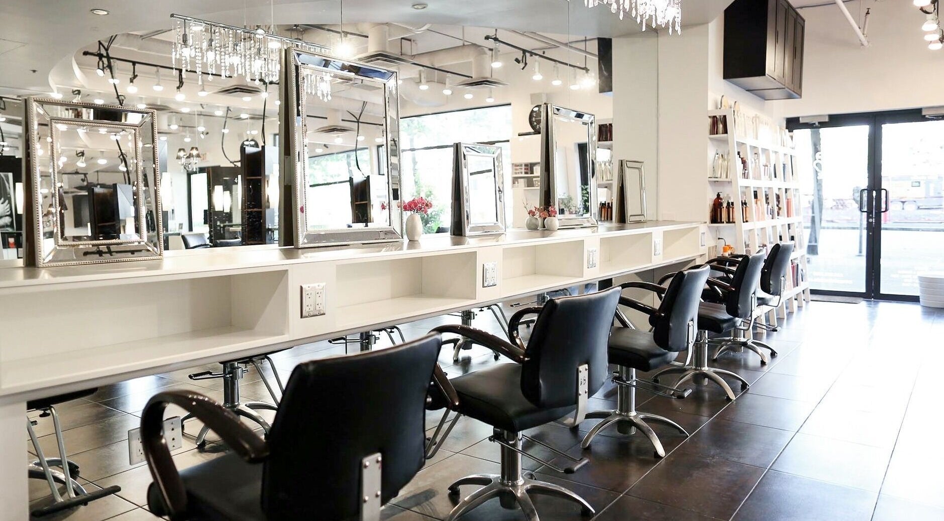 Elegant interior of The Lounge Hair Studio in Vancouver, British Columbia, CA with modern styling stations.