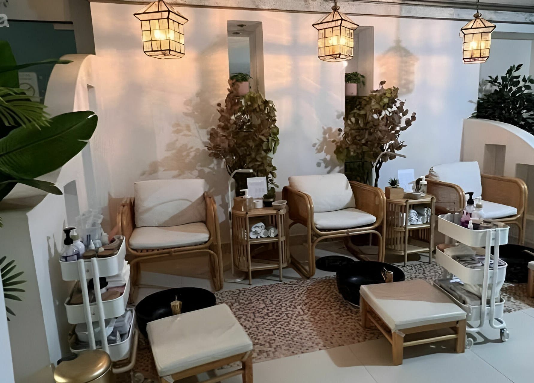 Elegant spa seating at Last Touch Salon, Dammam, Eastern Province with warm lighting and lush plants.
