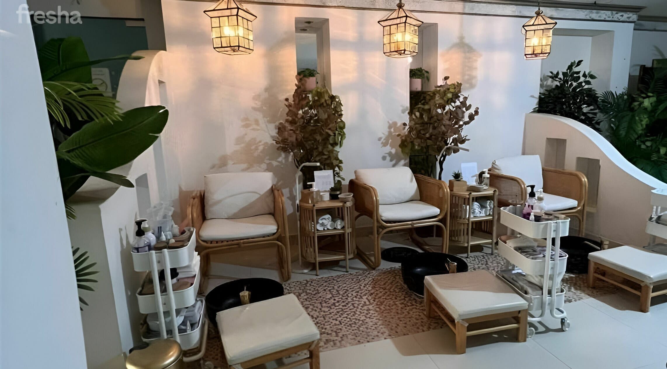 Elegant spa seating at Last Touch Salon, Dammam, Eastern Province with warm lighting and lush plants.