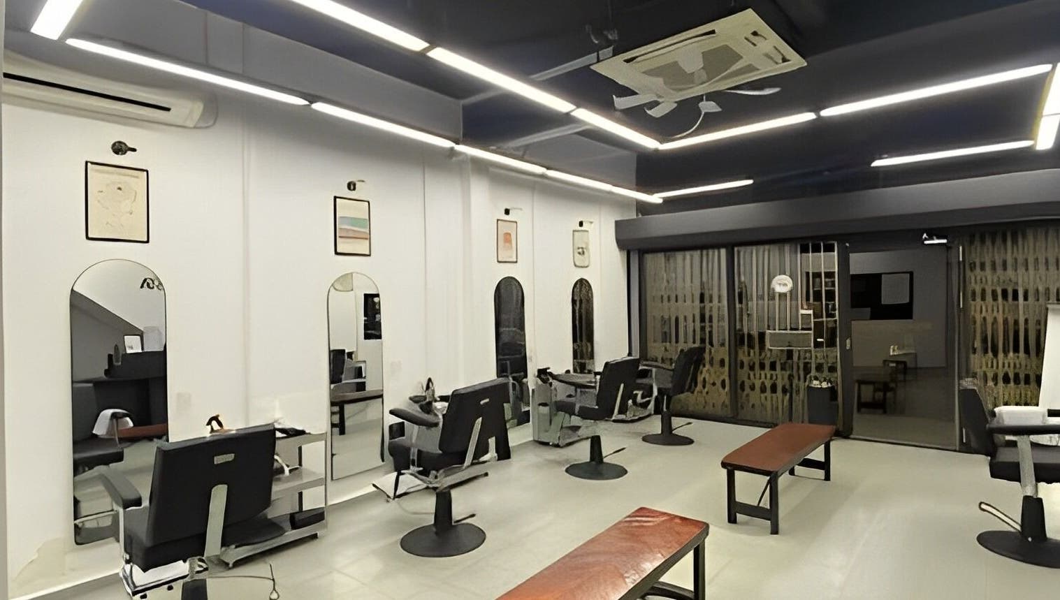 Modern interior of Cuts & Cloud Mawar salon in Pontian, Johor, MY with sleek chairs and mirrors.
