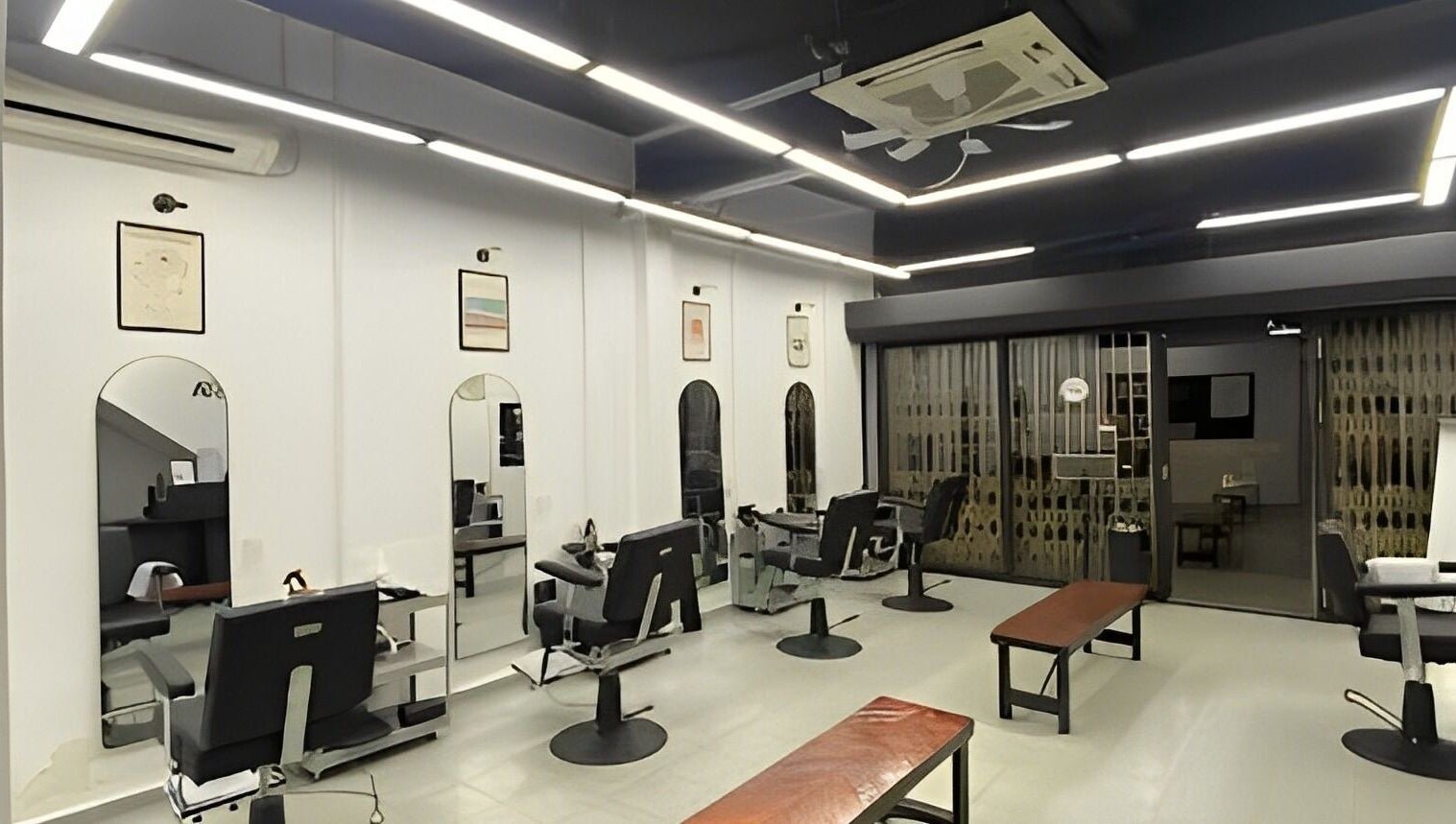 Modern interior of Cuts & Cloud Mawar salon in Pontian, Johor, MY with sleek chairs and mirrors.