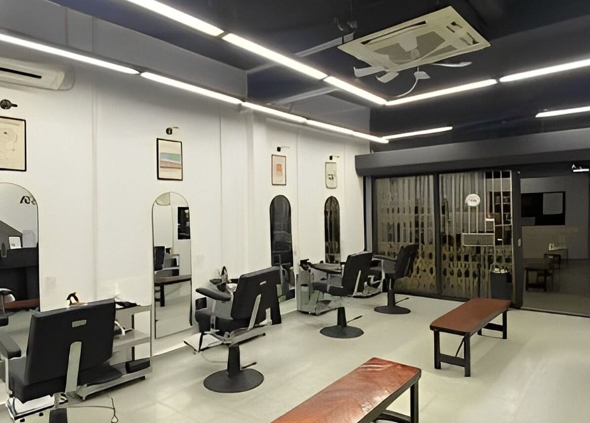 Modern interior of Cuts & Cloud Mawar salon in Pontian, Johor, MY with sleek chairs and mirrors.